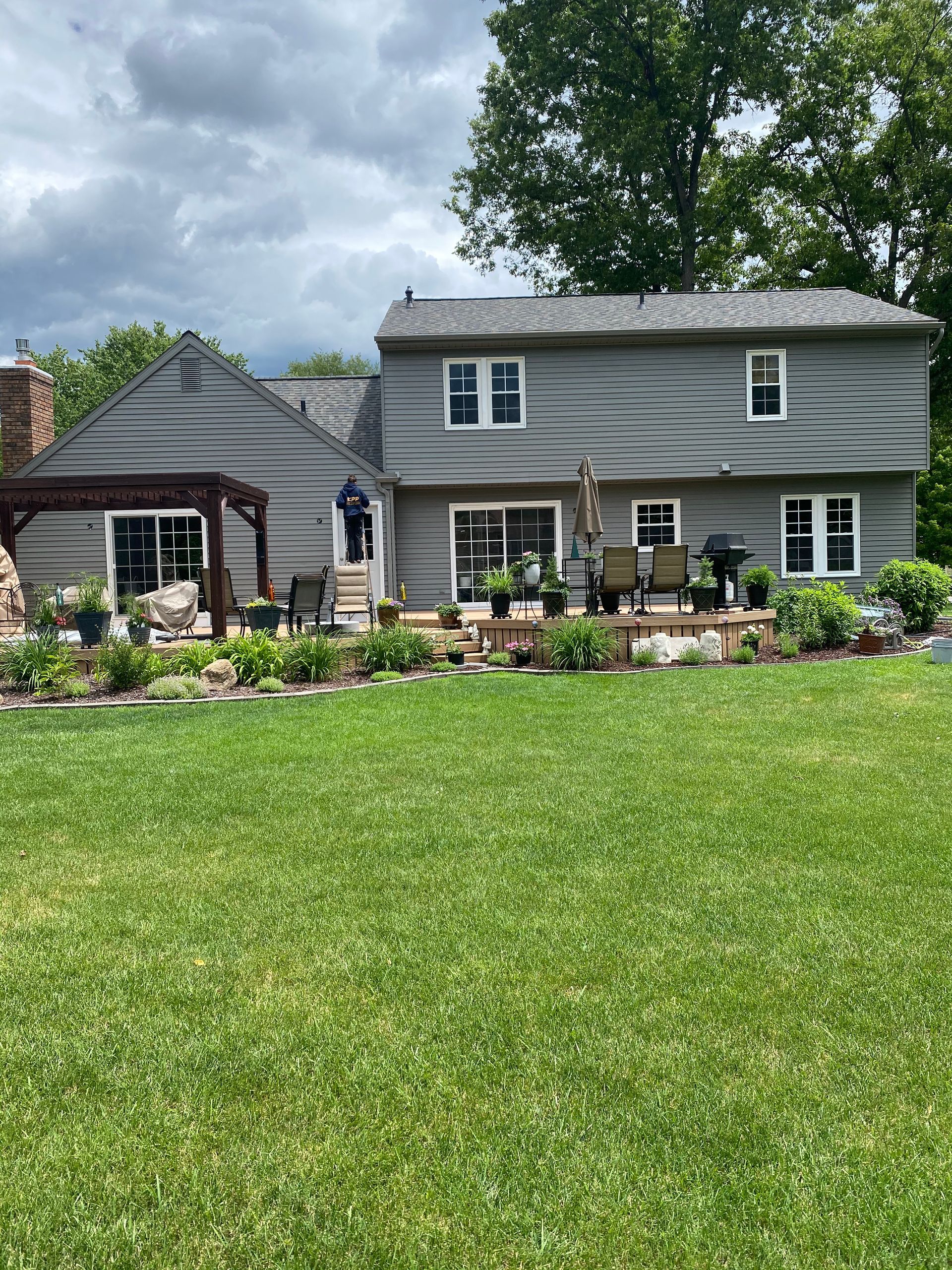 A large house with a large lawn in front of it.