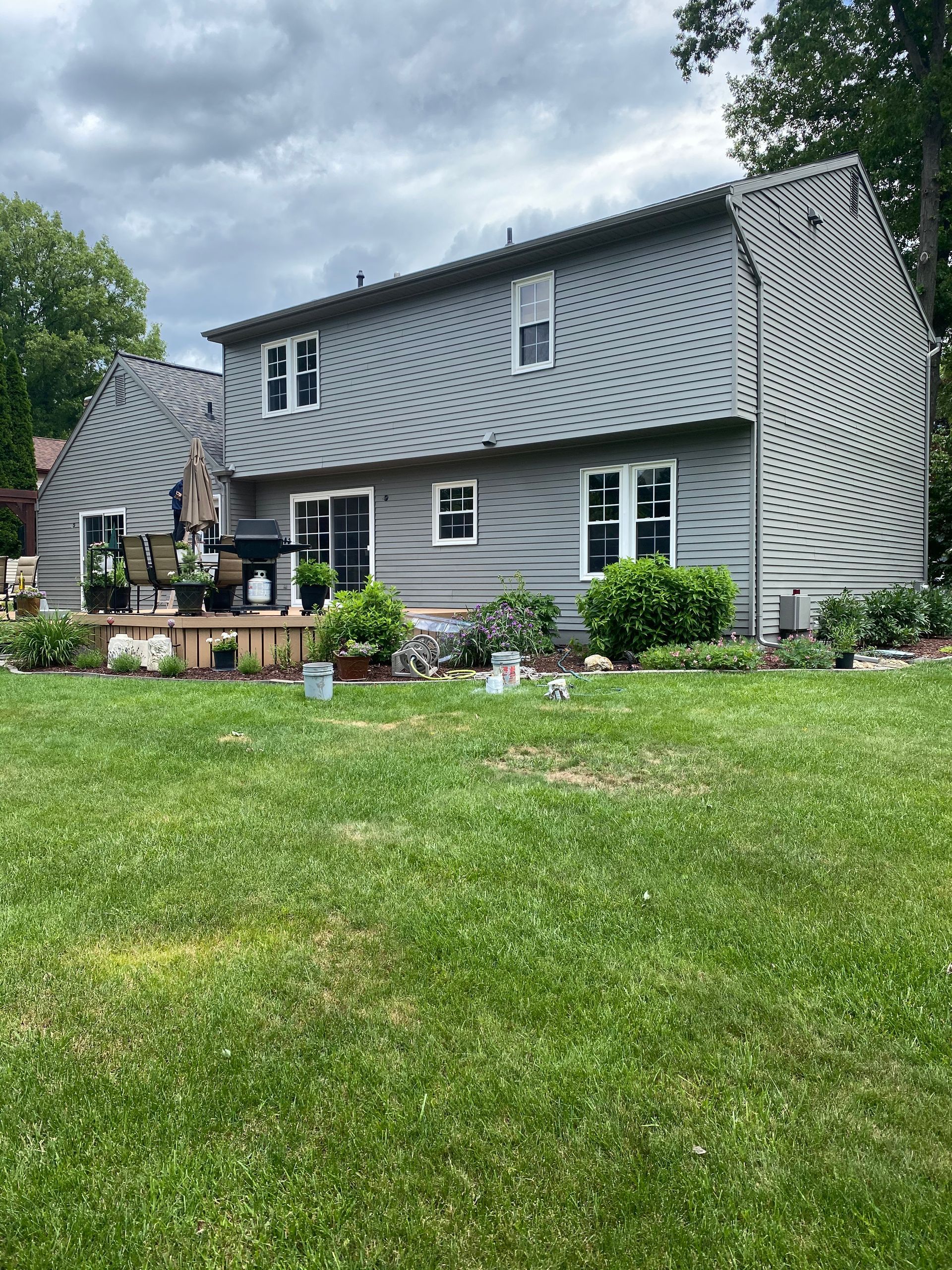 A large house with a large lawn in front of it.