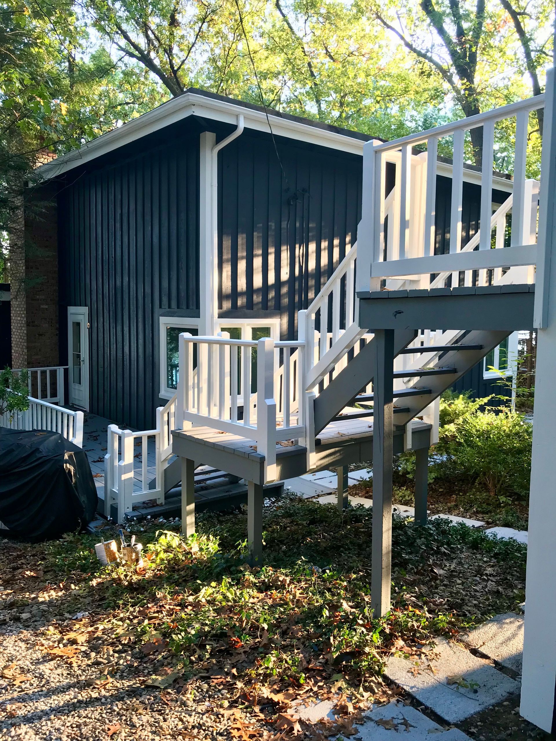 A small house with stairs leading up to it