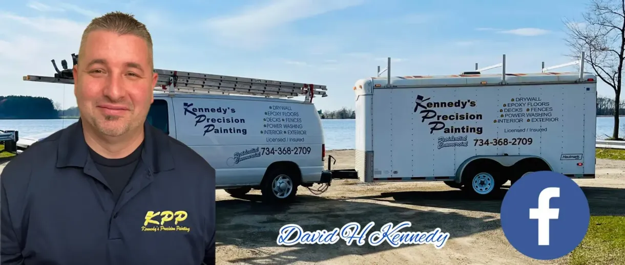A man is standing in front of a van and trailer.