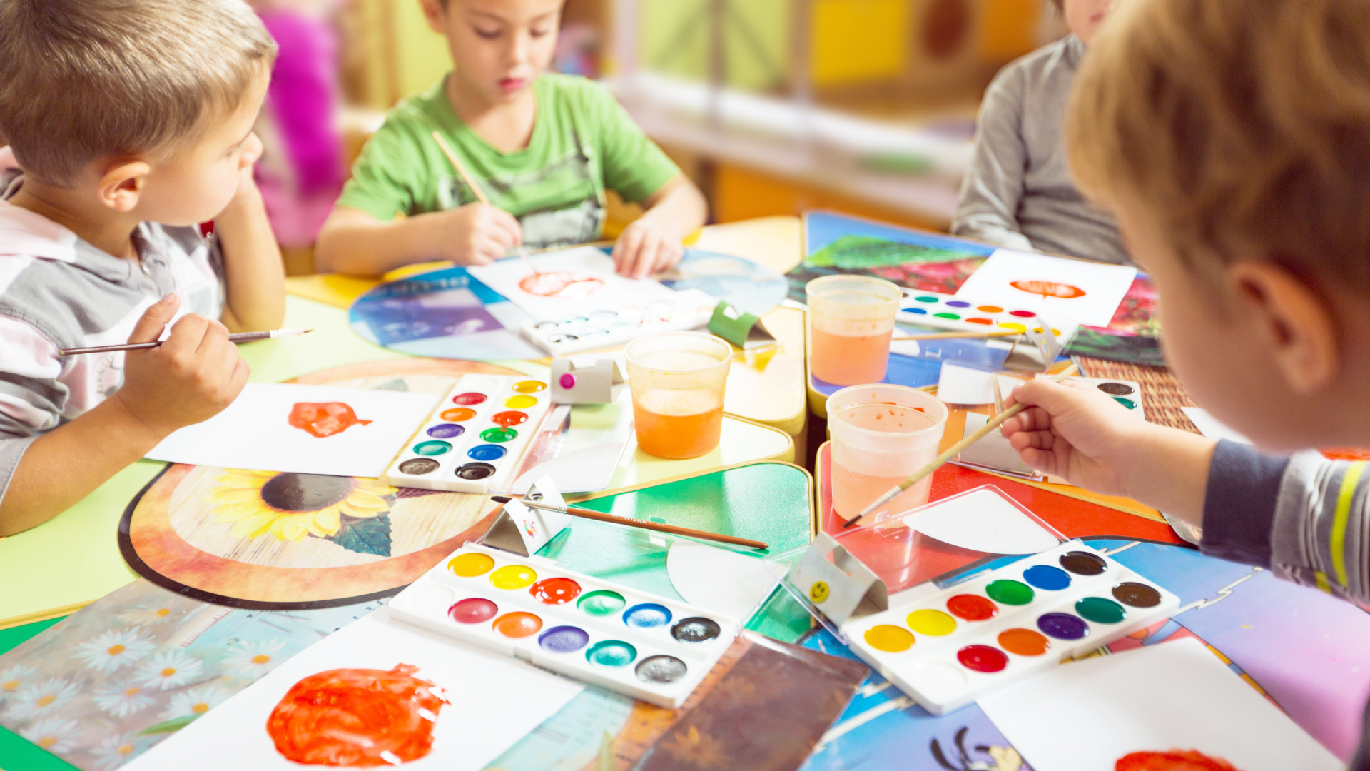 A table with a lot of colorful paper plates on it