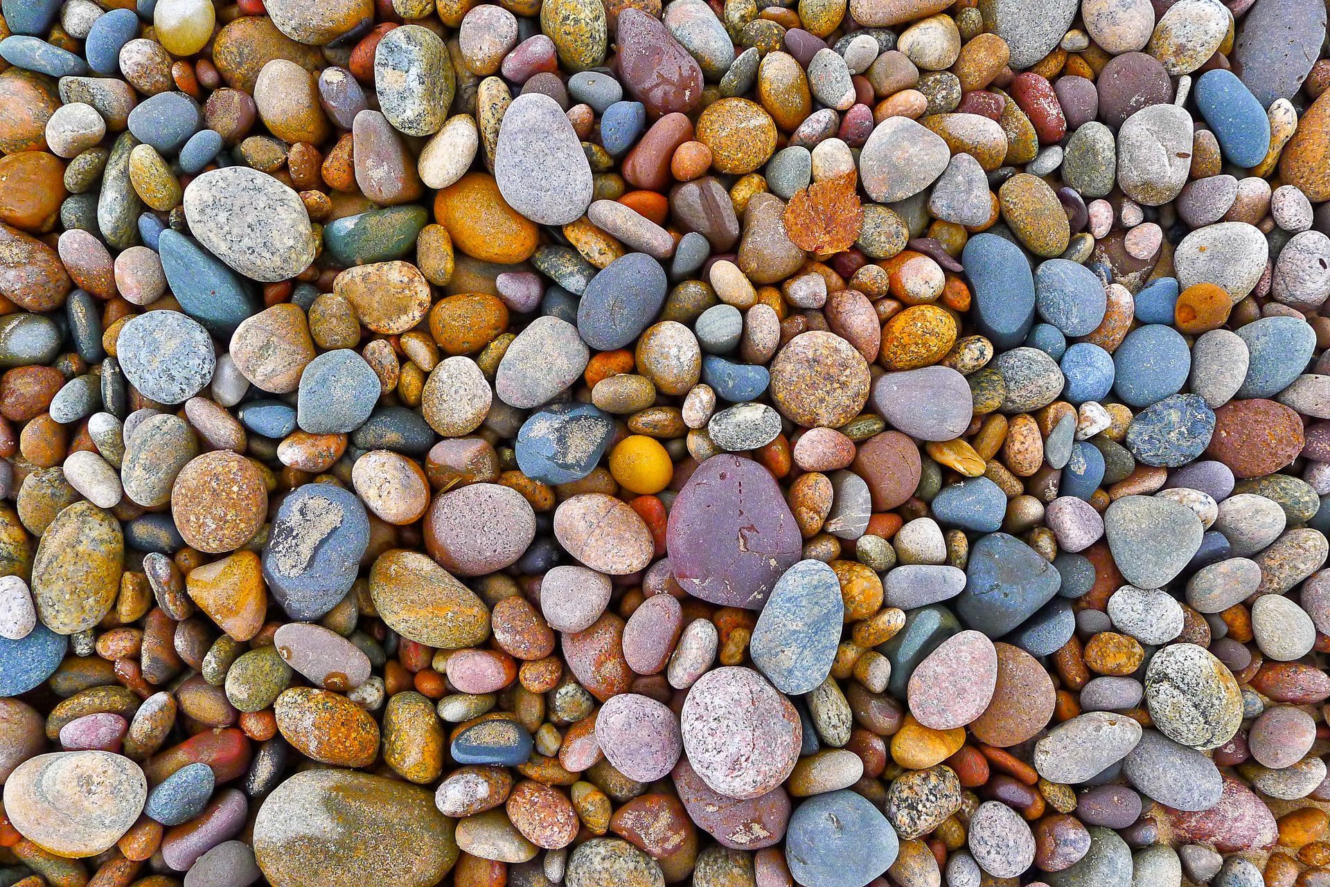 A pile of rocks of different colors and sizes A pile of rocks of different colors and sizes