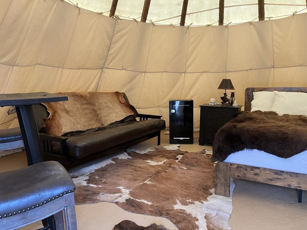 There is a couch and a bed in the room.