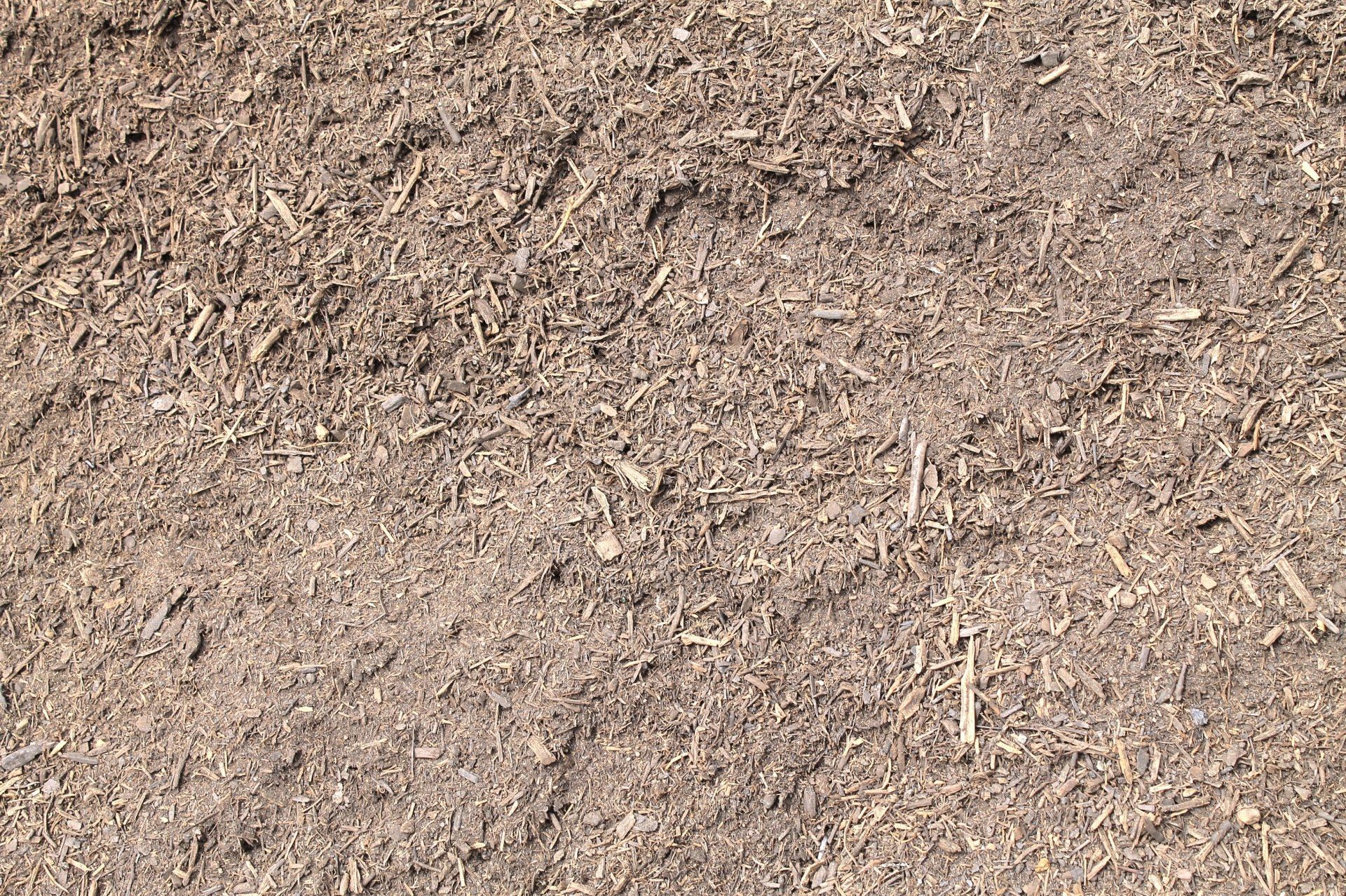 Close-up of brown mulch with various sized wood chips.