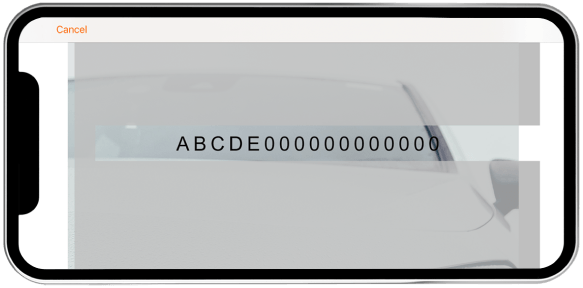Phone screen showing a cracked display with letters and numbers on a white background
