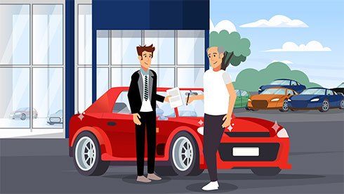 Two people stand beside a red sports car outside a dealership, with other cars in the background.