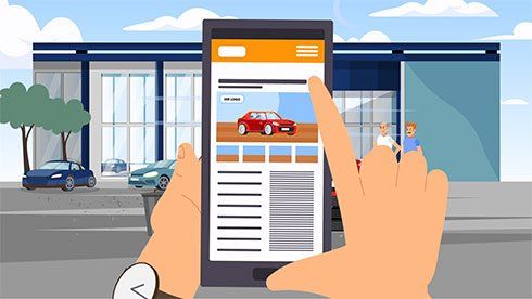 Hands holding a smartphone with a car listing in front of a dealership