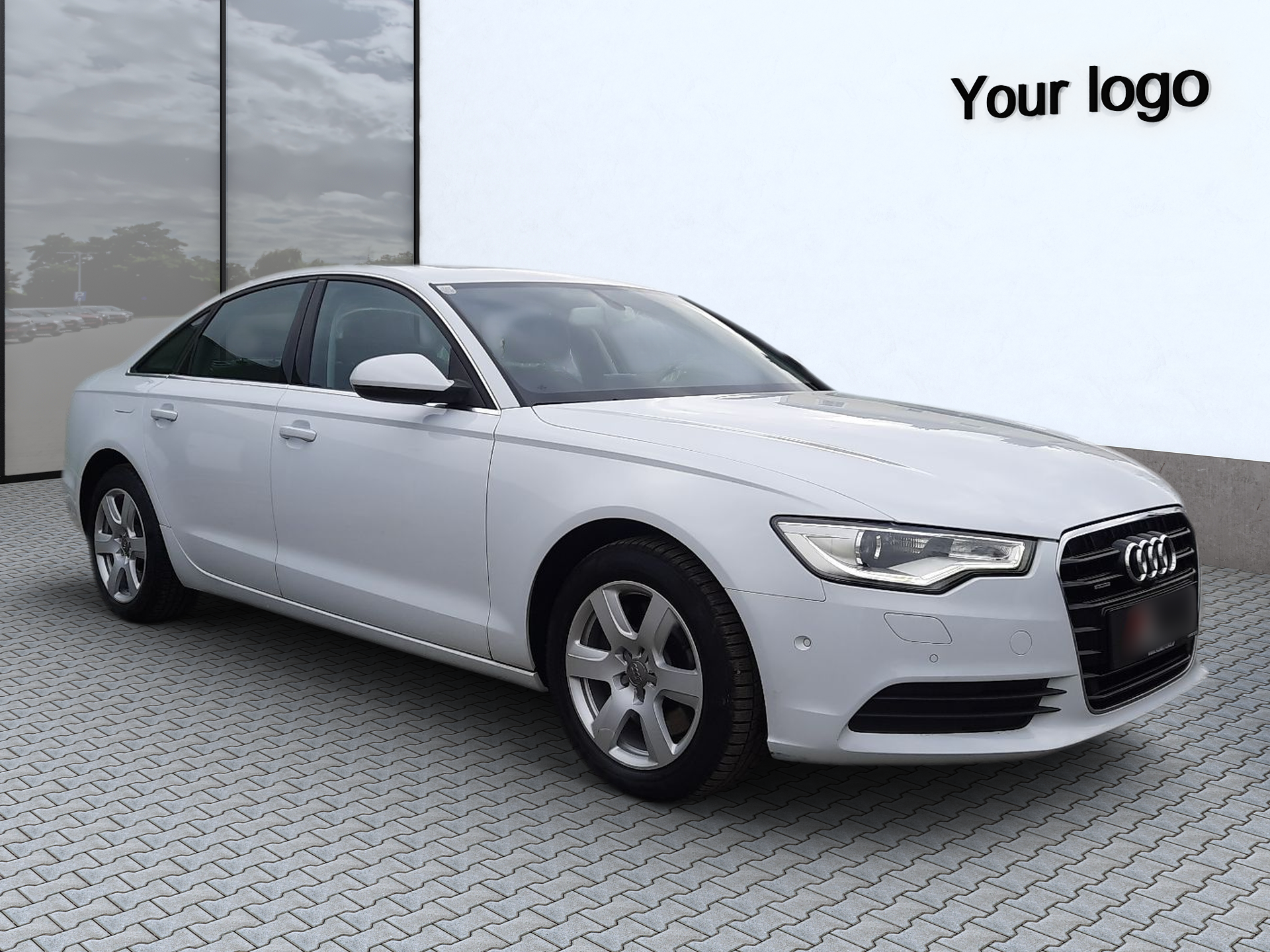 Exterior shots with your logo White sedan in front of a building, with a logo in the top-right corner.