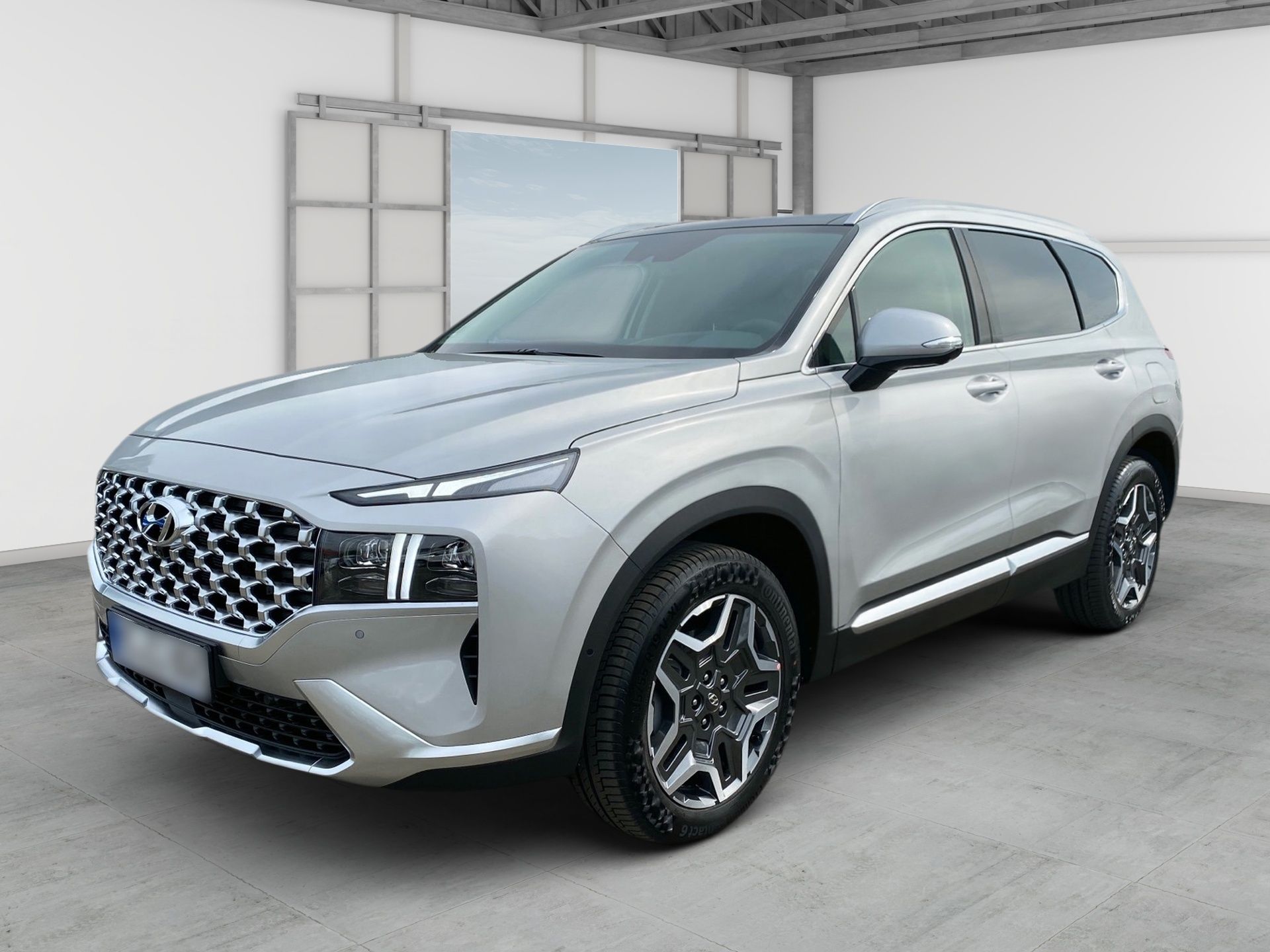 Silver SUV parked indoors in a bright showroom, front-left view
