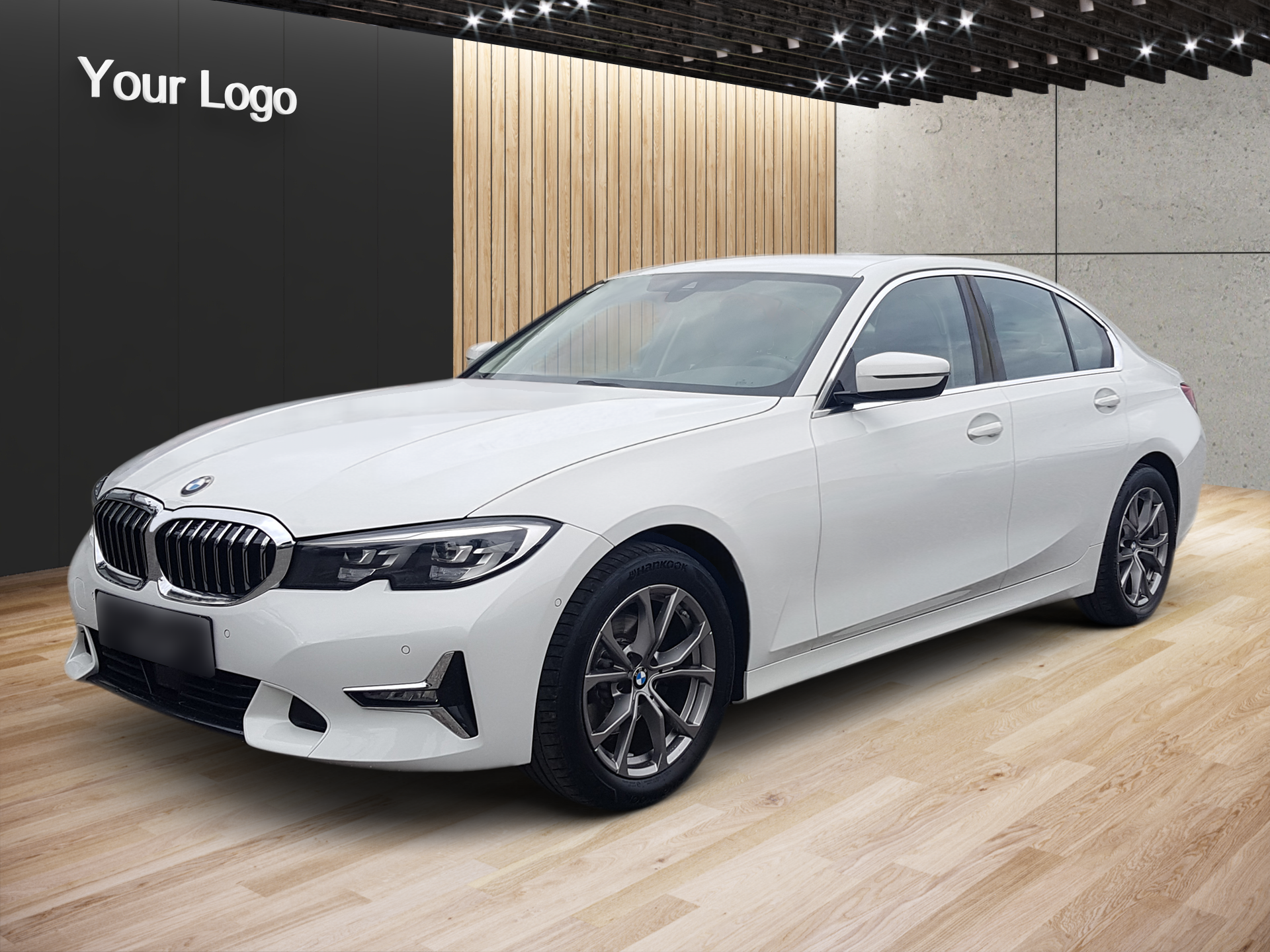 White BMW sedan in a showroom with wood flooring and a black wall background