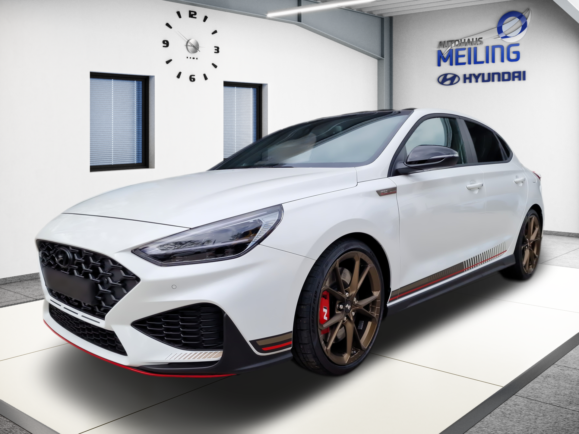 White Hyundai sedan in a showroom, angled front view with black and red accents.