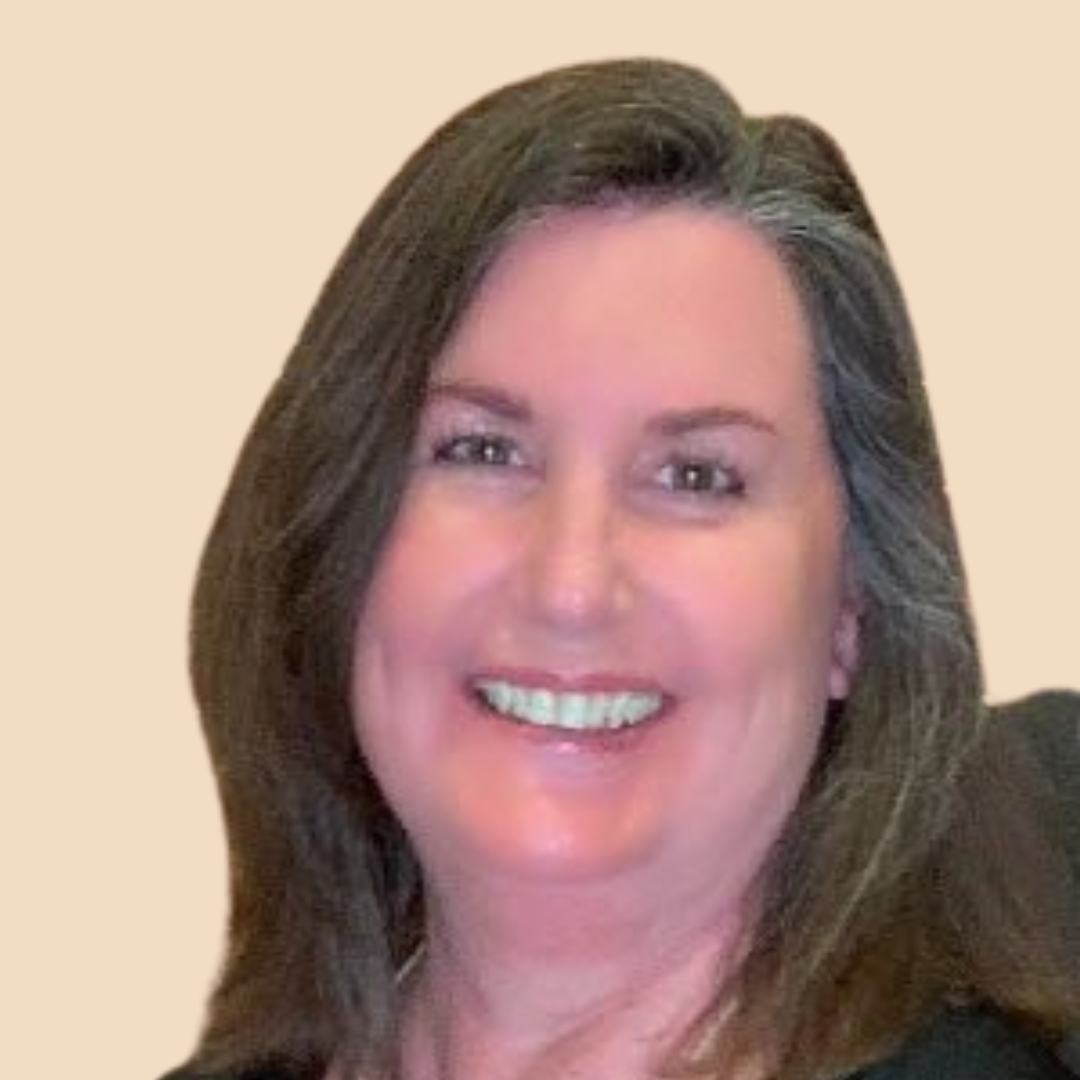 Smiling woman with shoulder-length brown hair against a beige background