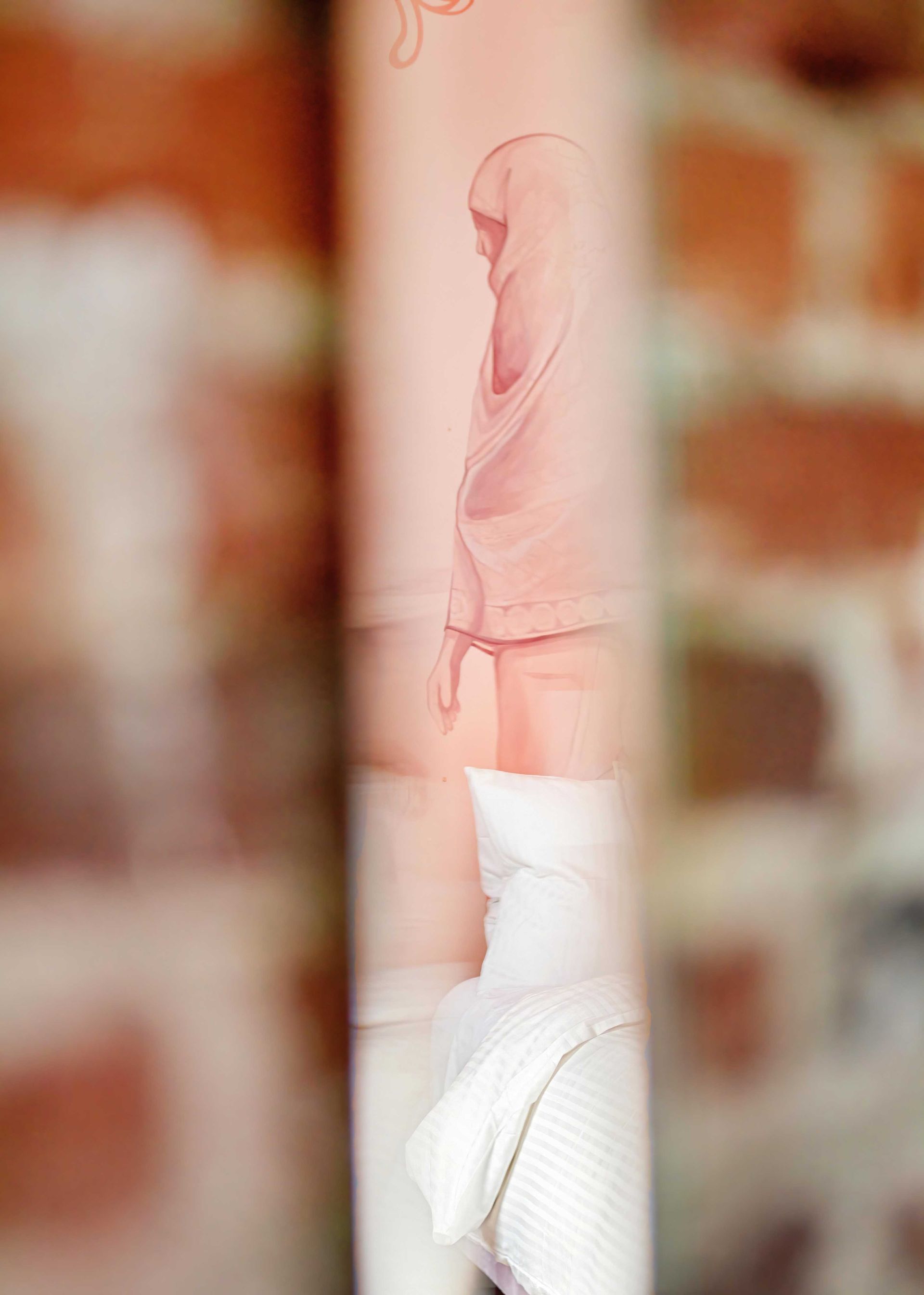 Person in a pink hoodie and white pants seen through blurred brick openings.