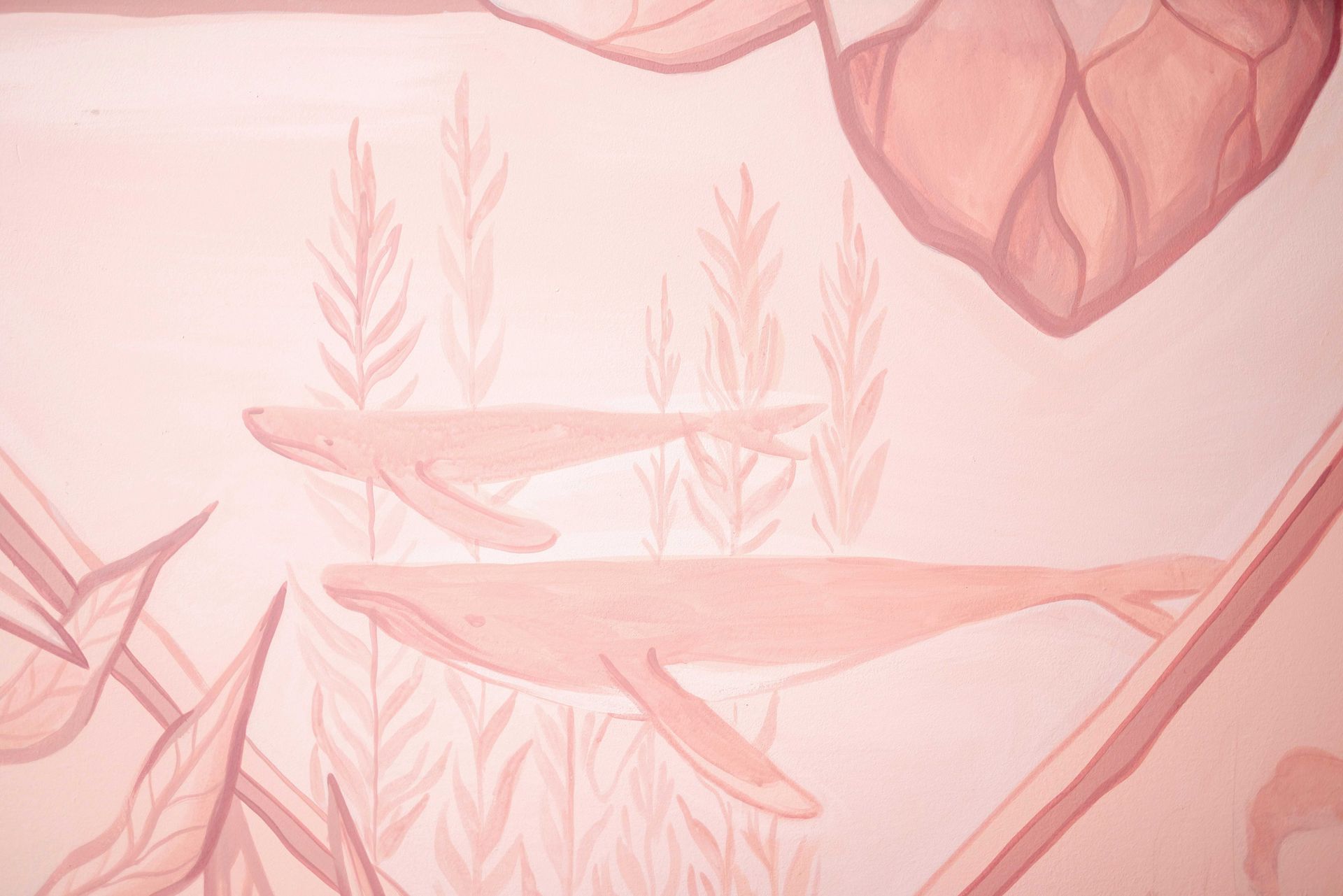 Soft pink underwater scene with fish, seaweed, and coral-like shapes