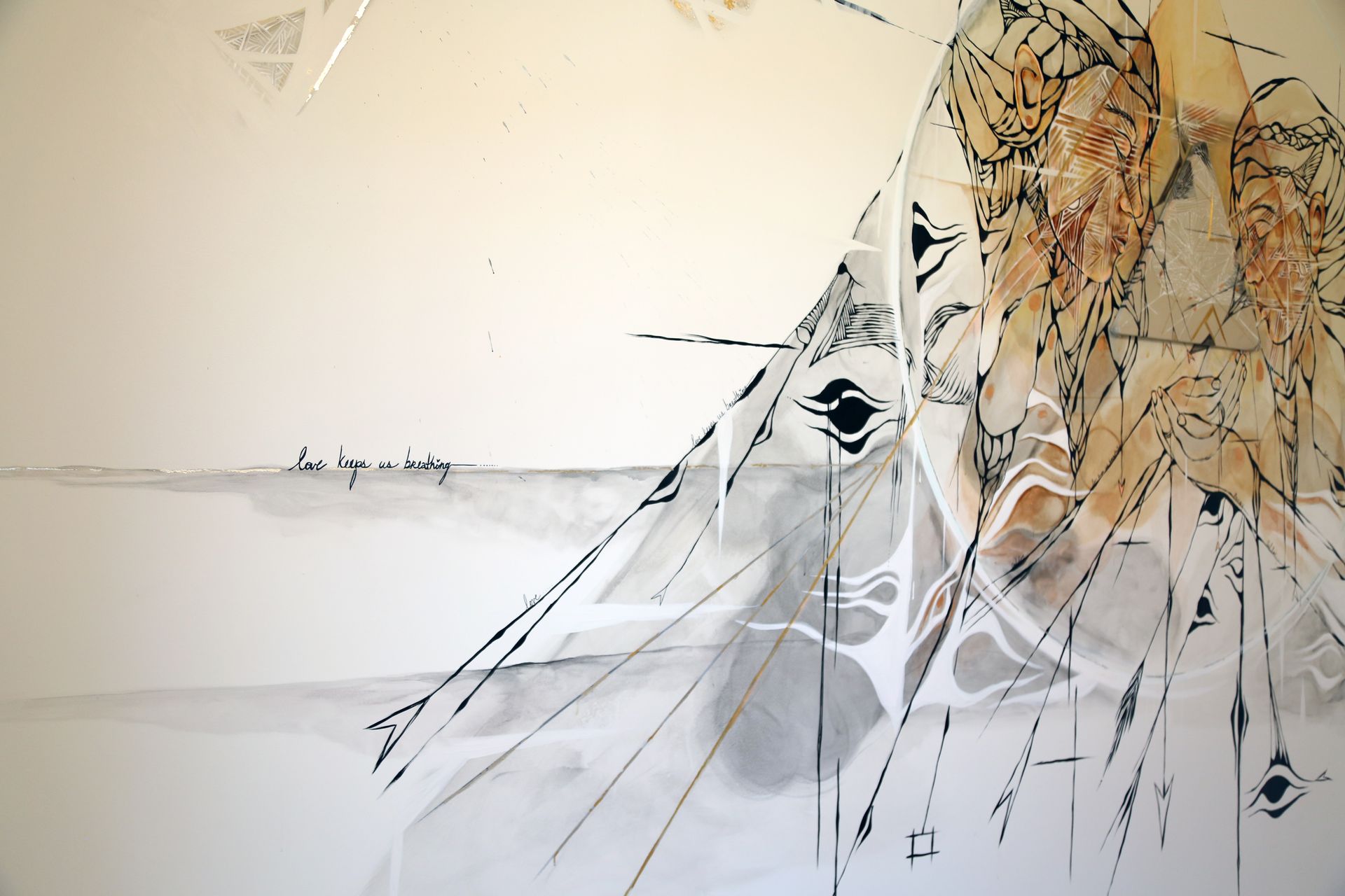 Abstract lion illustration with black linework and beige tones on a white background
