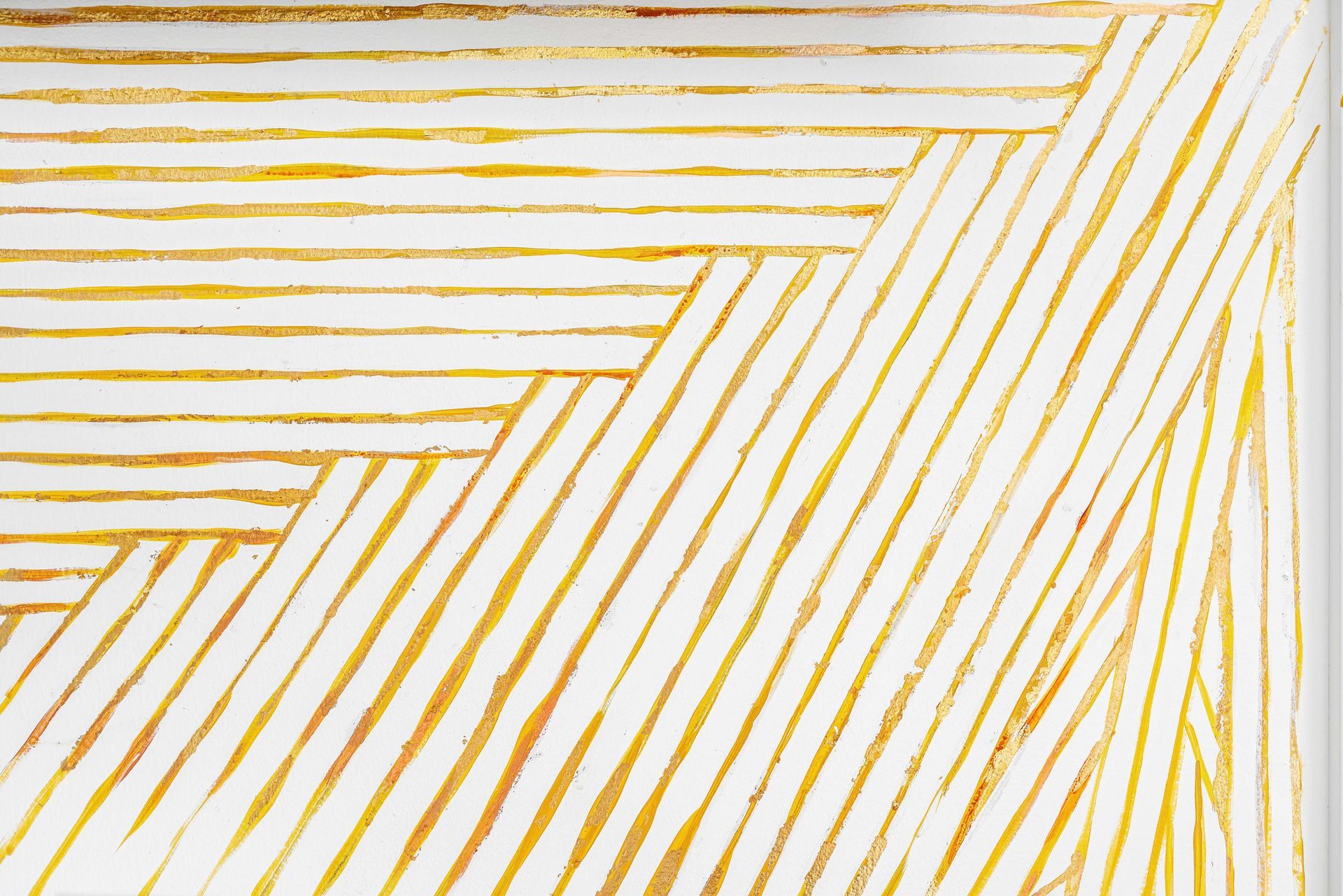 Abstract white background with intersecting gold diagonal lines forming a geometric pattern