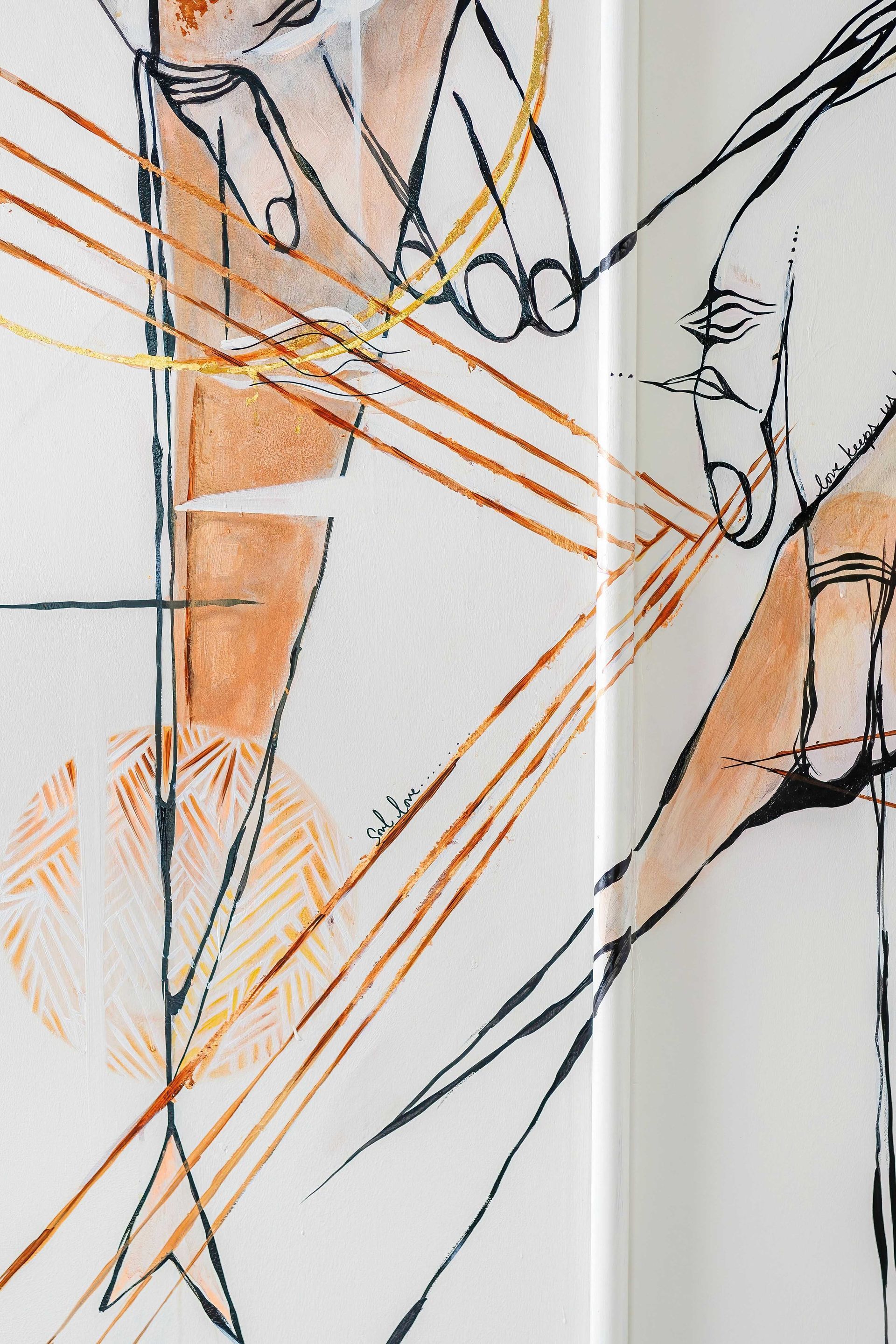 Abstract sketch of two faces in profile with orange diagonal lines on a white background
