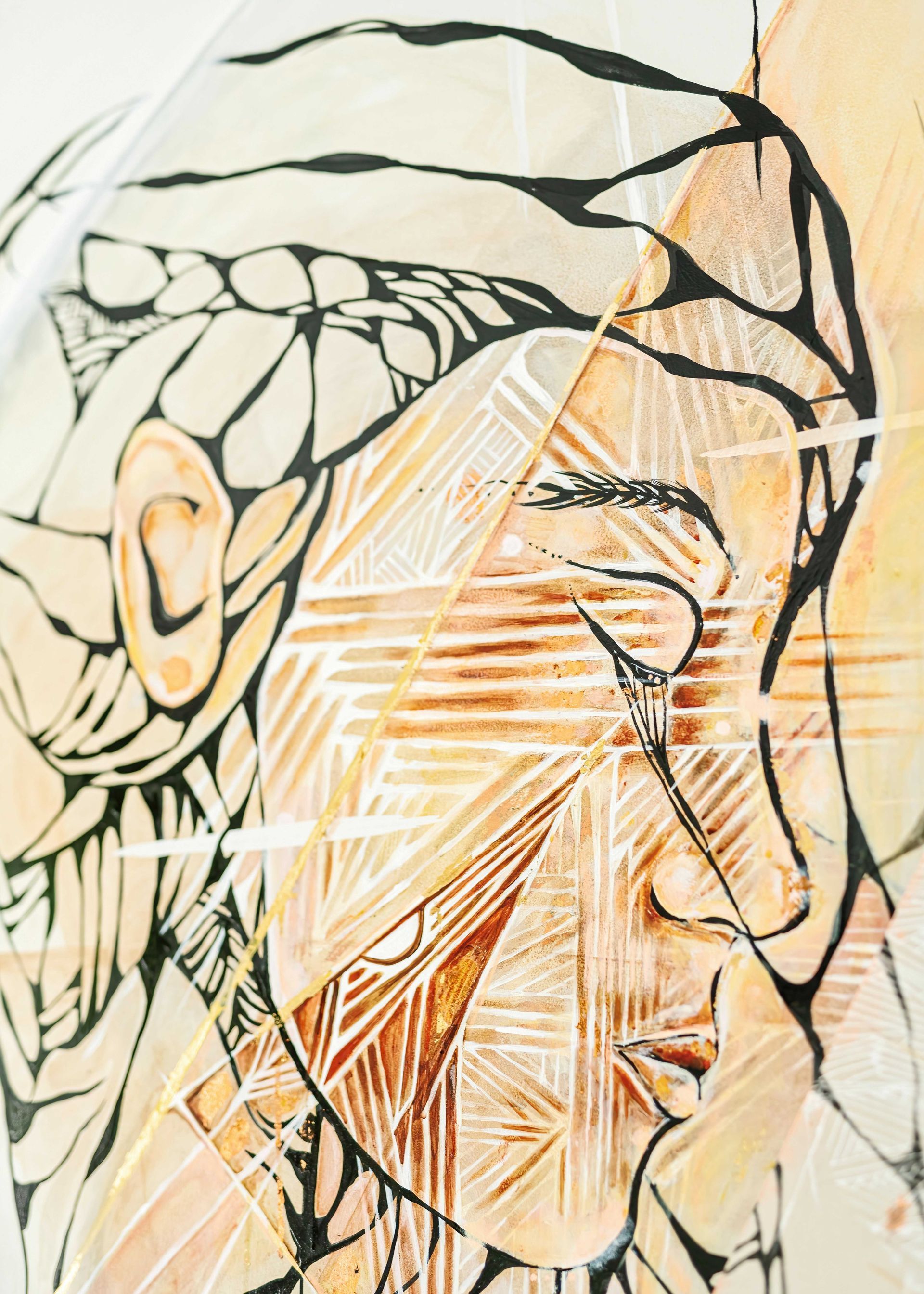 Abstract line-art portrait with warm beige tones, a profile face, and geometric orange accents