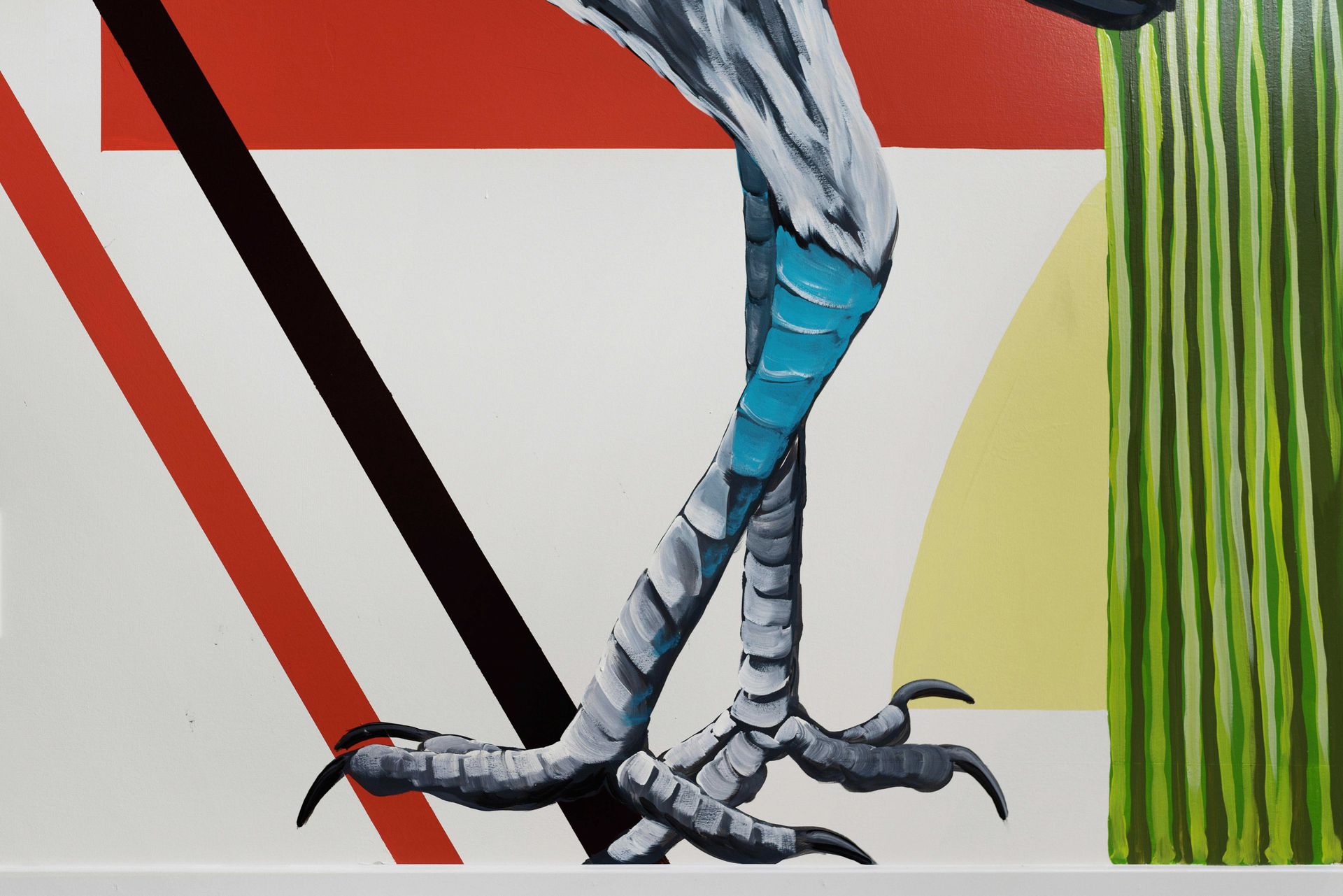 Bird’s lower body and clawed feet in a colorful abstract mural with red, white, yellow, and green sections