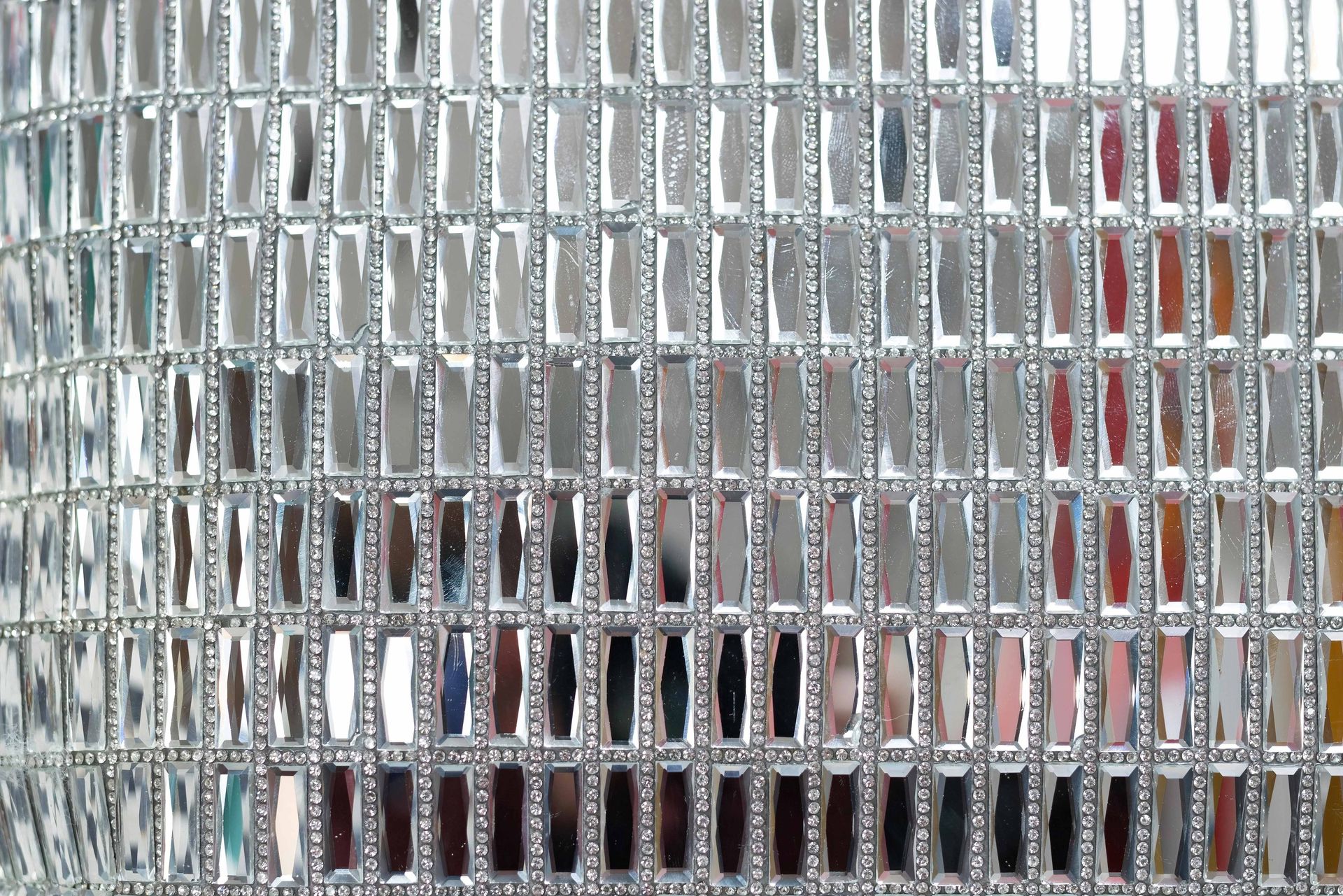 Blurred view through frosted glass with a white vehicle and red accents behind it