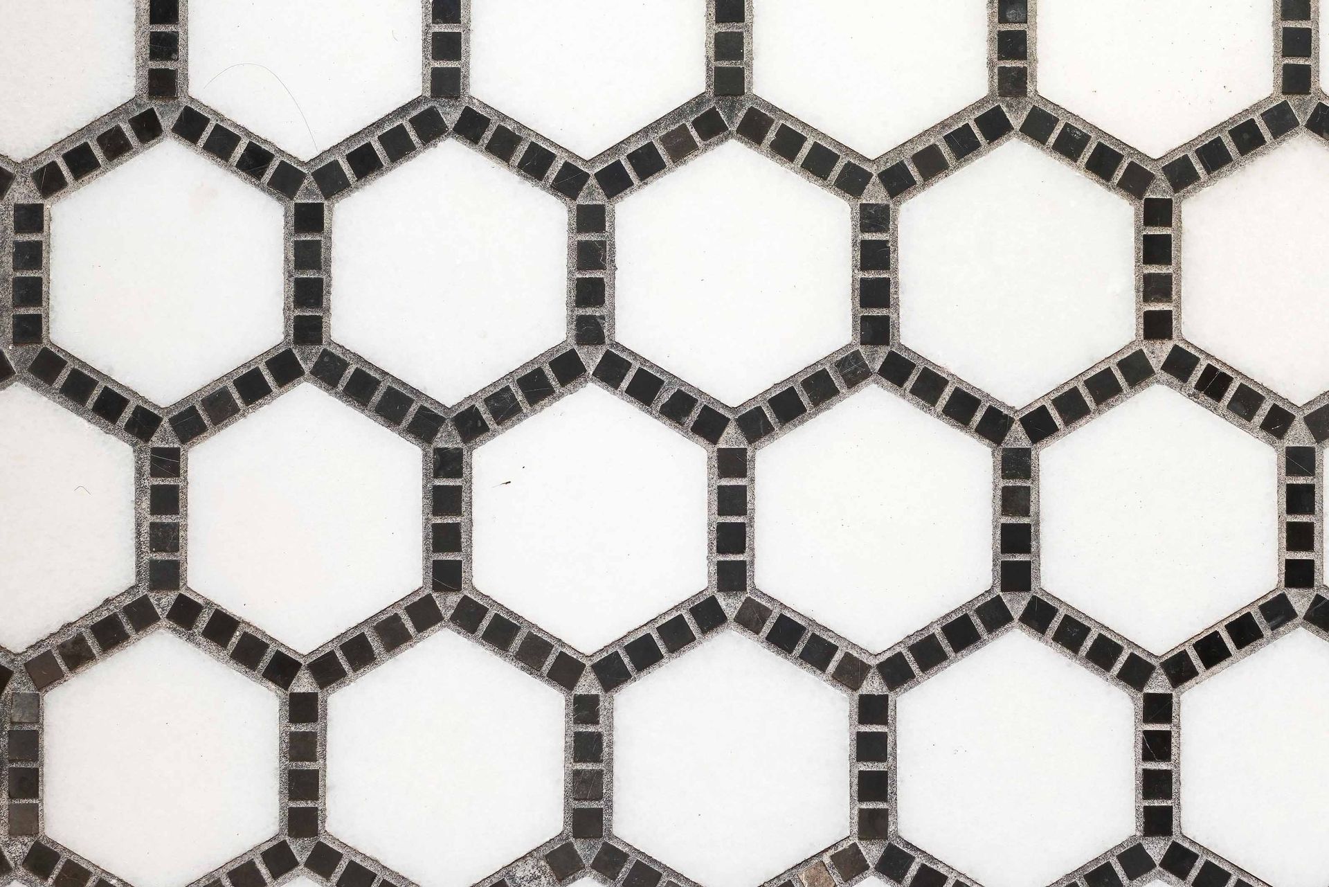 Black-and-white hexagonal tile pattern on a wall or floor