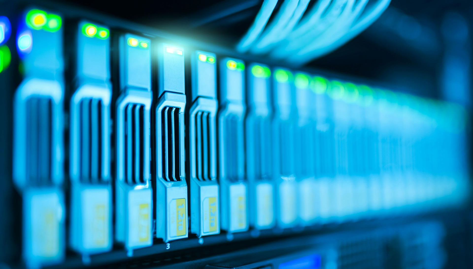 High security data servers with network cables and active indicator lights in a modern data centre