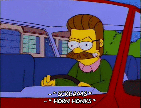Ned Flanders, from The Simpsons, honks the horn and screams while driving a red car.