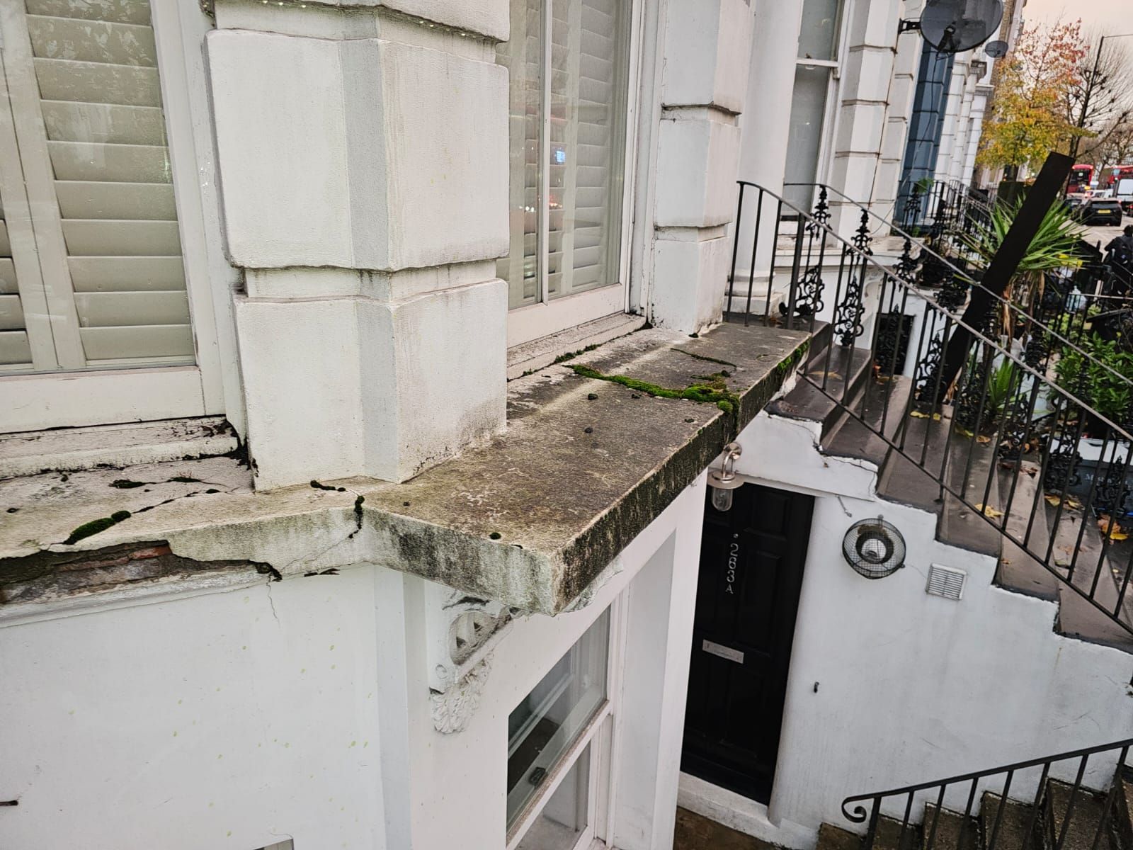 Repair of exterior window board in North London before picture