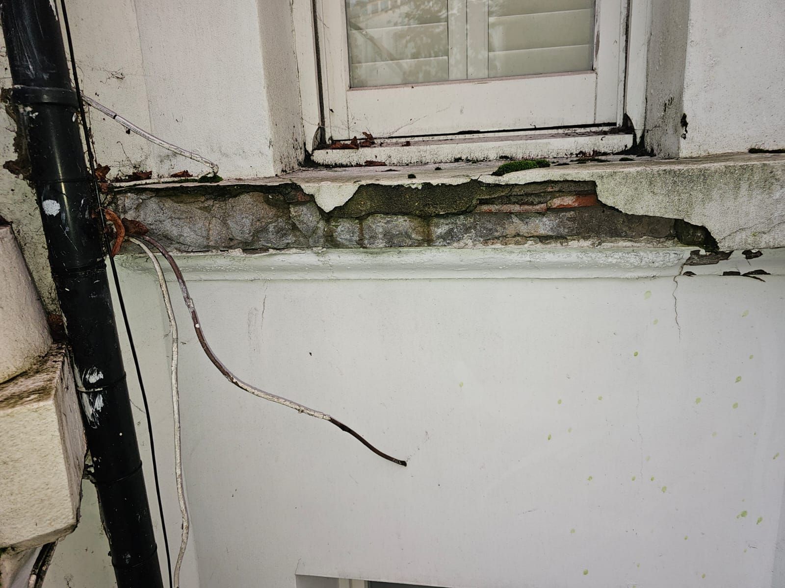Before picture of a exterior painting work window board in North london