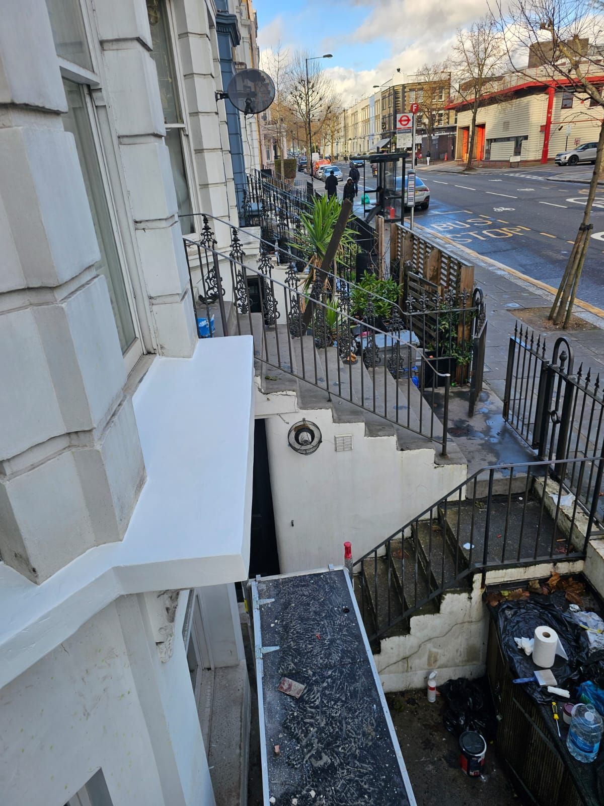 Exterior repair and painting of window board in North London
