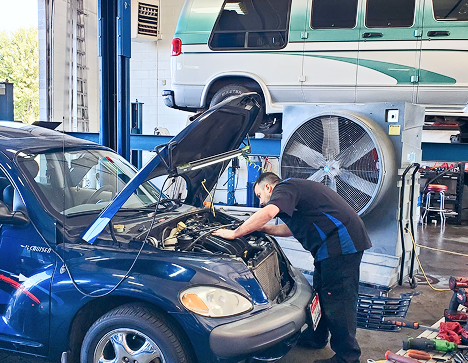 Mechanic working on car | John's Auto Care