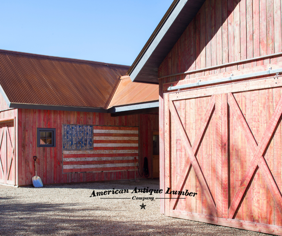 Faded red stain reclaimed wood garages with faded American Flag painted on one wall.