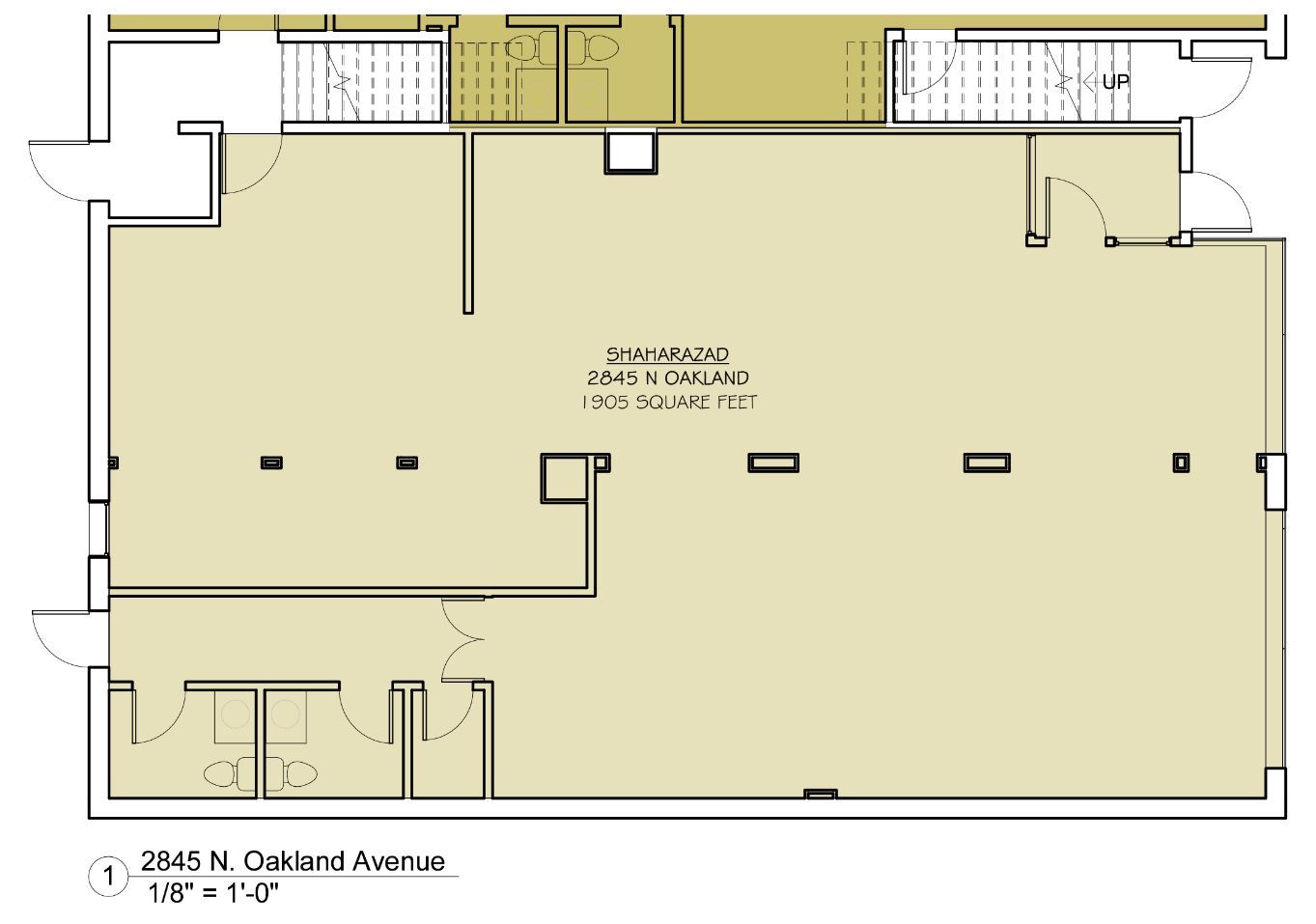 A floor plan of a large room with a staircase