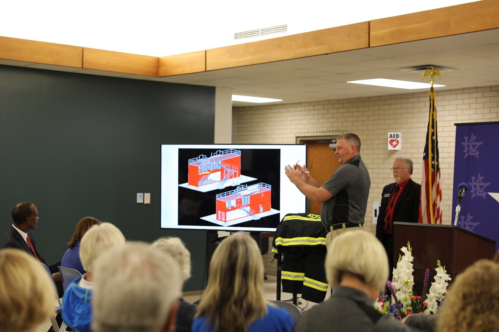 A man is giving a presentation to a group of people