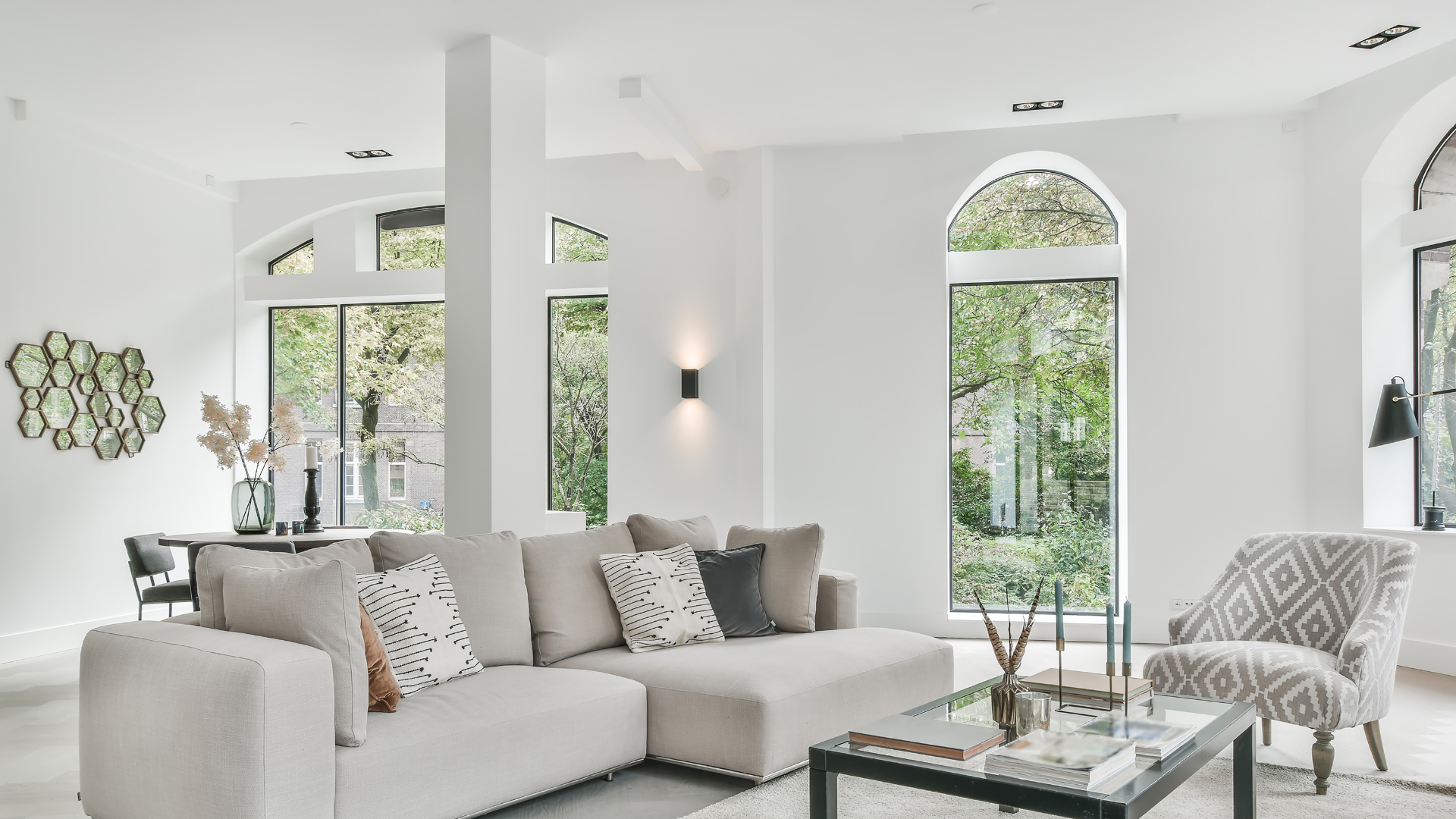 a living room with a couch , chair and coffee table .