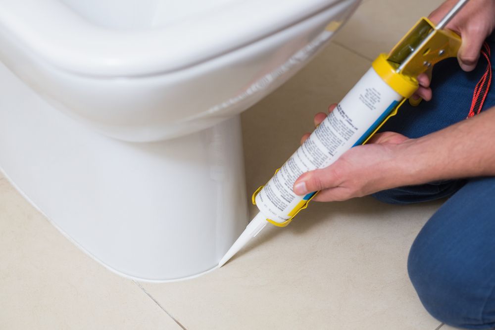 Plumber Fixing Toilet — Your Local Plumber in Armidale, NSW