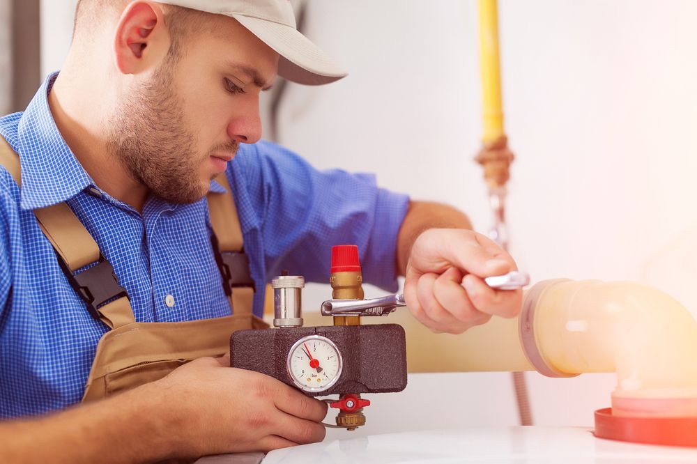 Technician Servicing Gas Boiler — Your Local Plumber in Narrabri, NSW