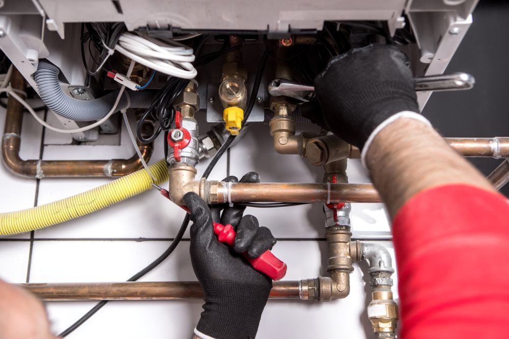 Plumber Repairing Pipes — Your Local Plumber in Tamworth, NSW
