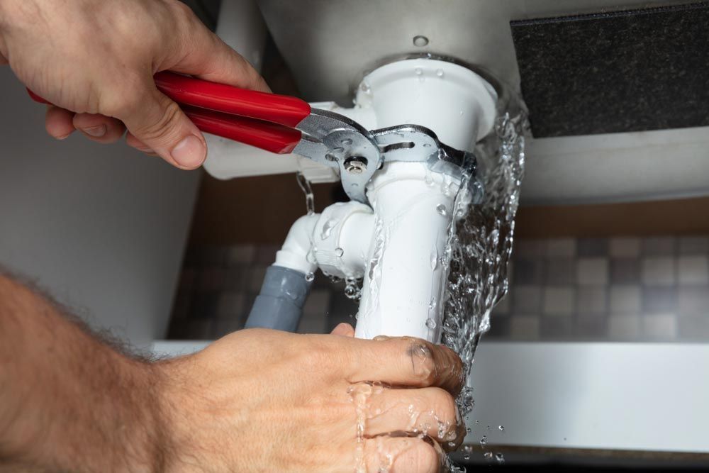 Water Flowing From A Blocked Pipe And Drains