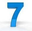 A blue number seven on a white background.