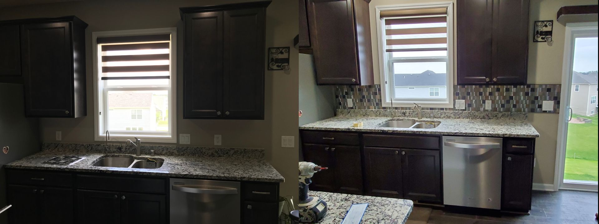 Dark kitchen with black cabinets, granite countertops, and two small windows above the sink area.