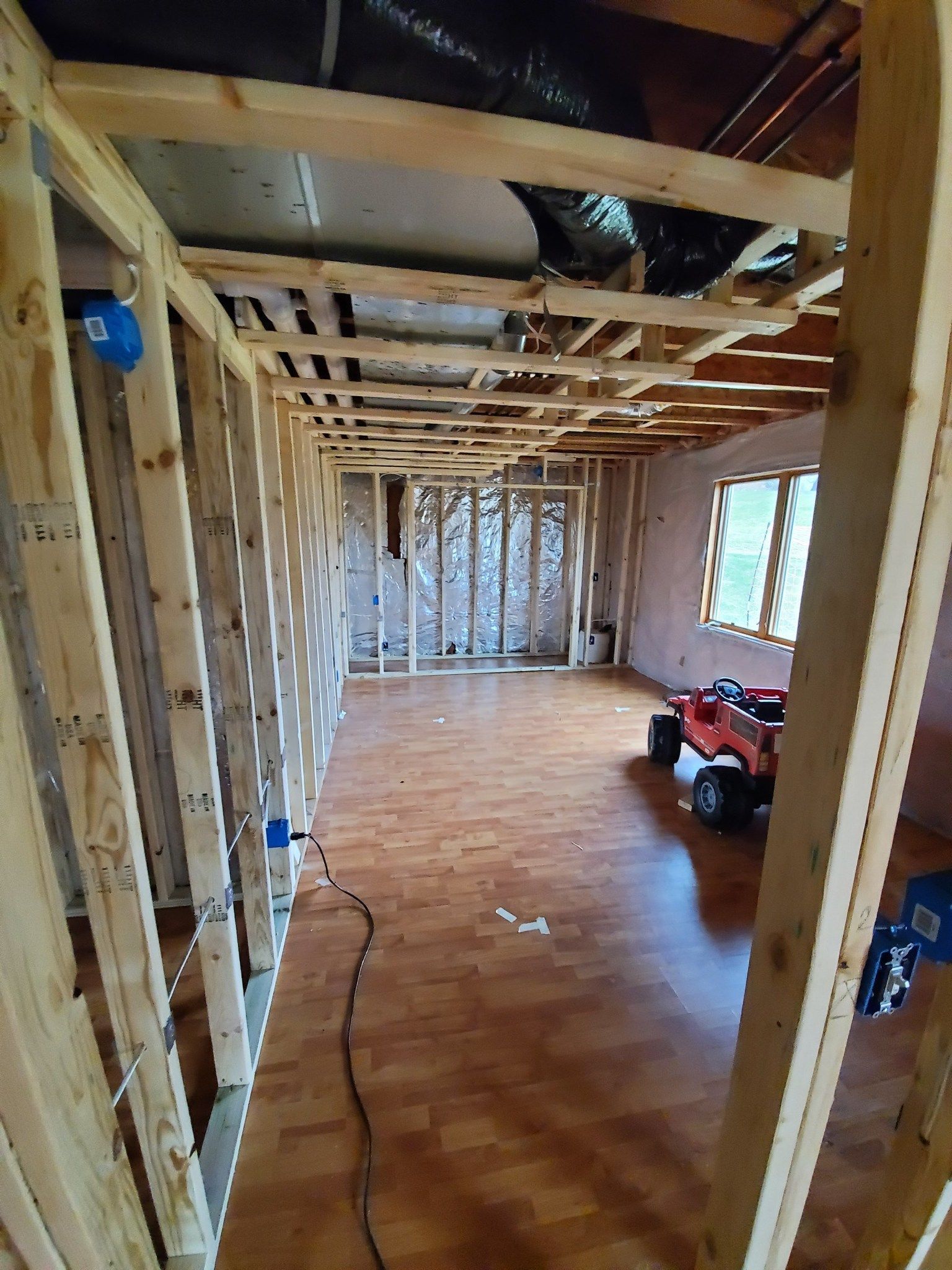 Basement remodeling in progress: framing, HVAC, electrical, and insulation are coordinated before drywall and finishes are installed 