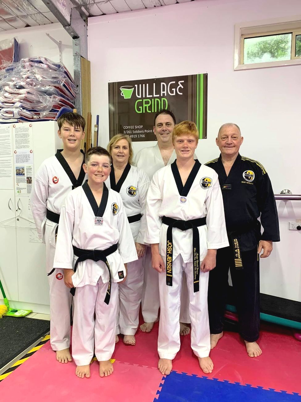 A Group of People in Karate Uniforms Are Posing for a Picture — Him-Do Tae Kwon Do Academy In Salamander Bay, NSW