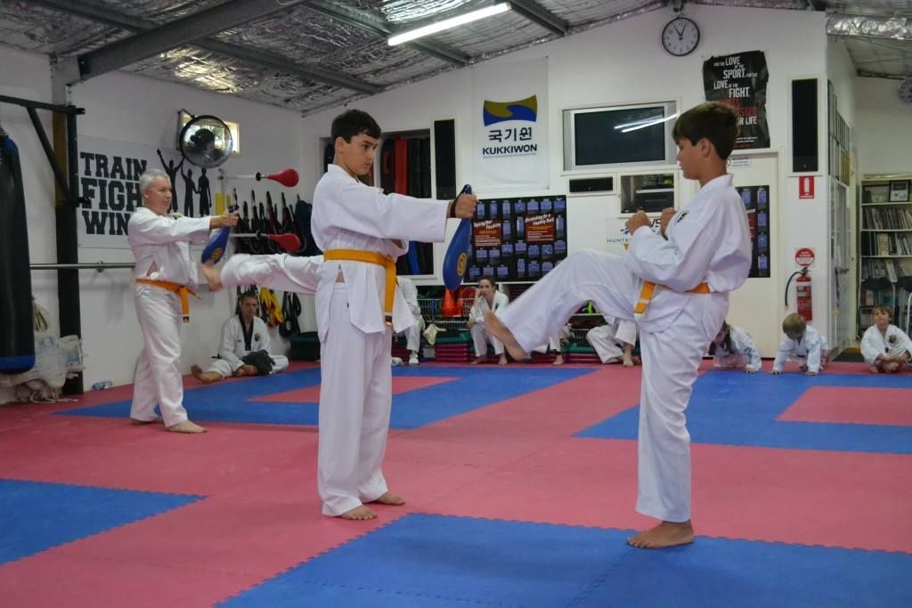 Kid Practicing His Kicks — Him-Do Tae Kwon Do Academy In Salamander Bay, NSW