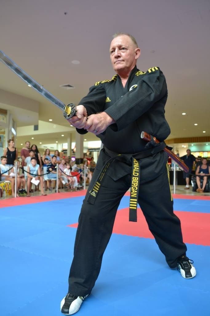 Man Holding A Sword — Him-Do Tae Kwon Do Academy In Salamander Bay, NSW