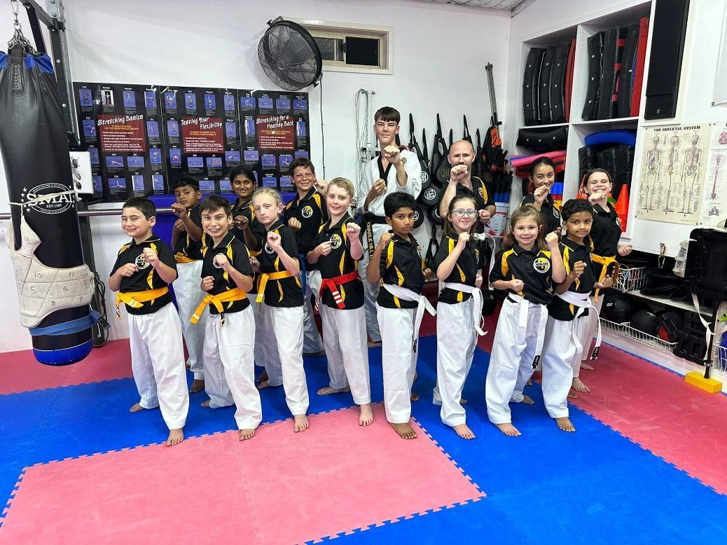 A Group of Children Are Posing for a Picture — Him-Do Tae Kwon Do Academy In Salamander Bay, NSW