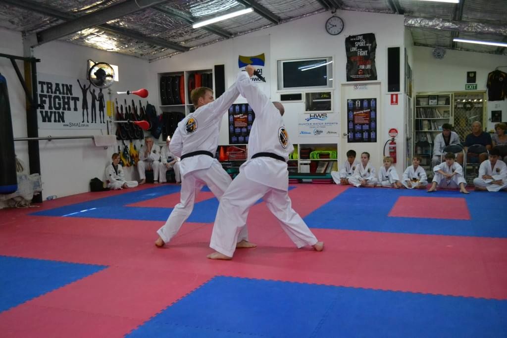 A Group of People Are Practicing Self Defense — Him-Do Tae Kwon Do Academy In Salamander Bay, NSW
