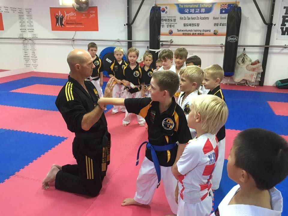 A Group of Young Boys Are Practicing Martial Arts in a Gym — Him-Do Tae Kwon Do Academy In Salamander Bay, NSW