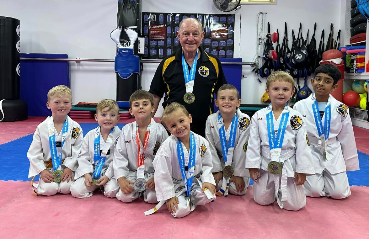 A Group of Young Boys Wearing Medals Are Posing for a Picture — Him-Do Tae Kwon Do Academy In Salamander Bay, NSW