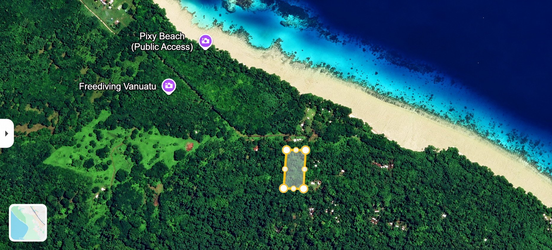 Satellite map of a tropical beach resort surrounded by dense green forest and turquoise water